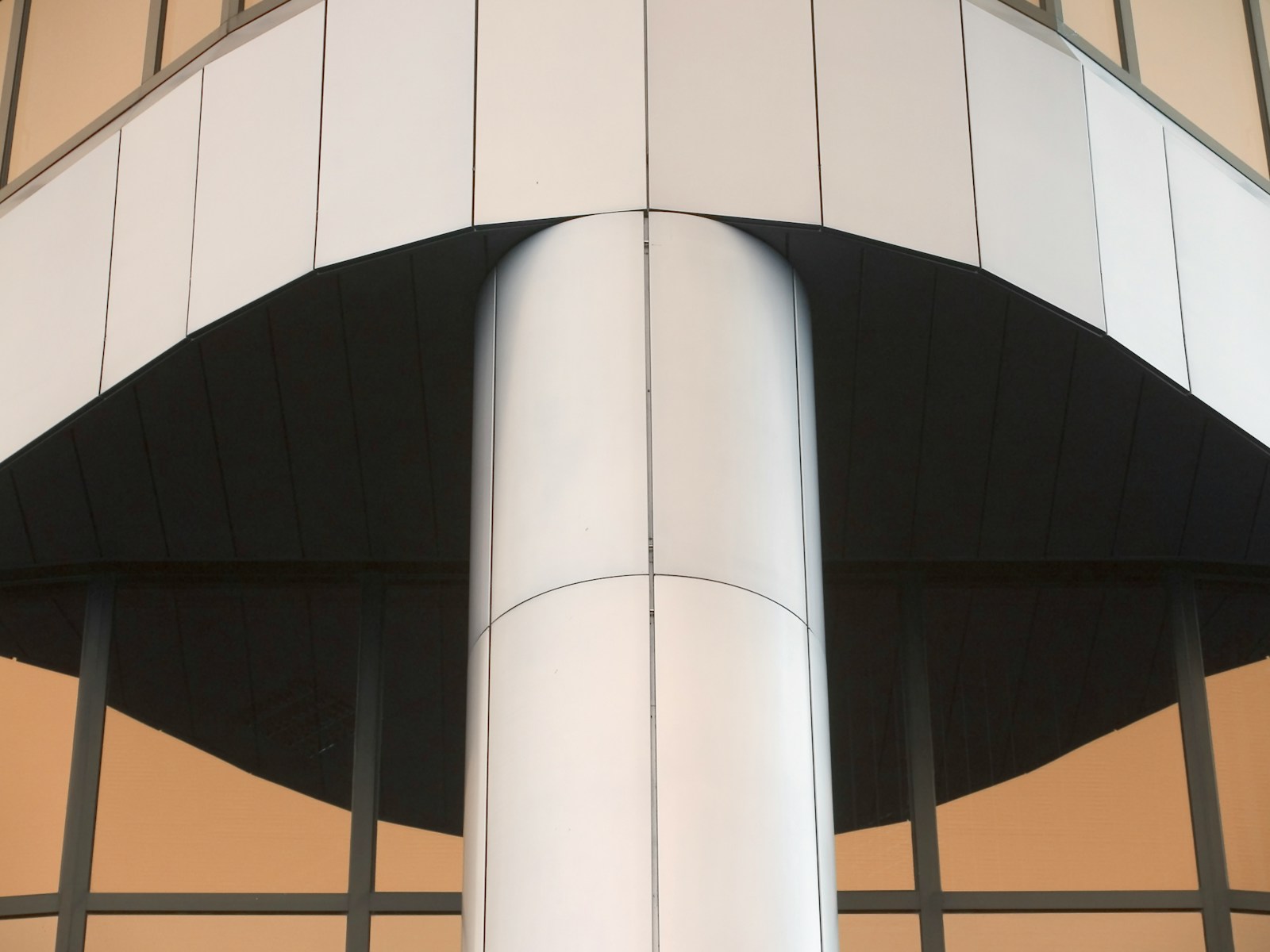 a large metal pole in front of a building